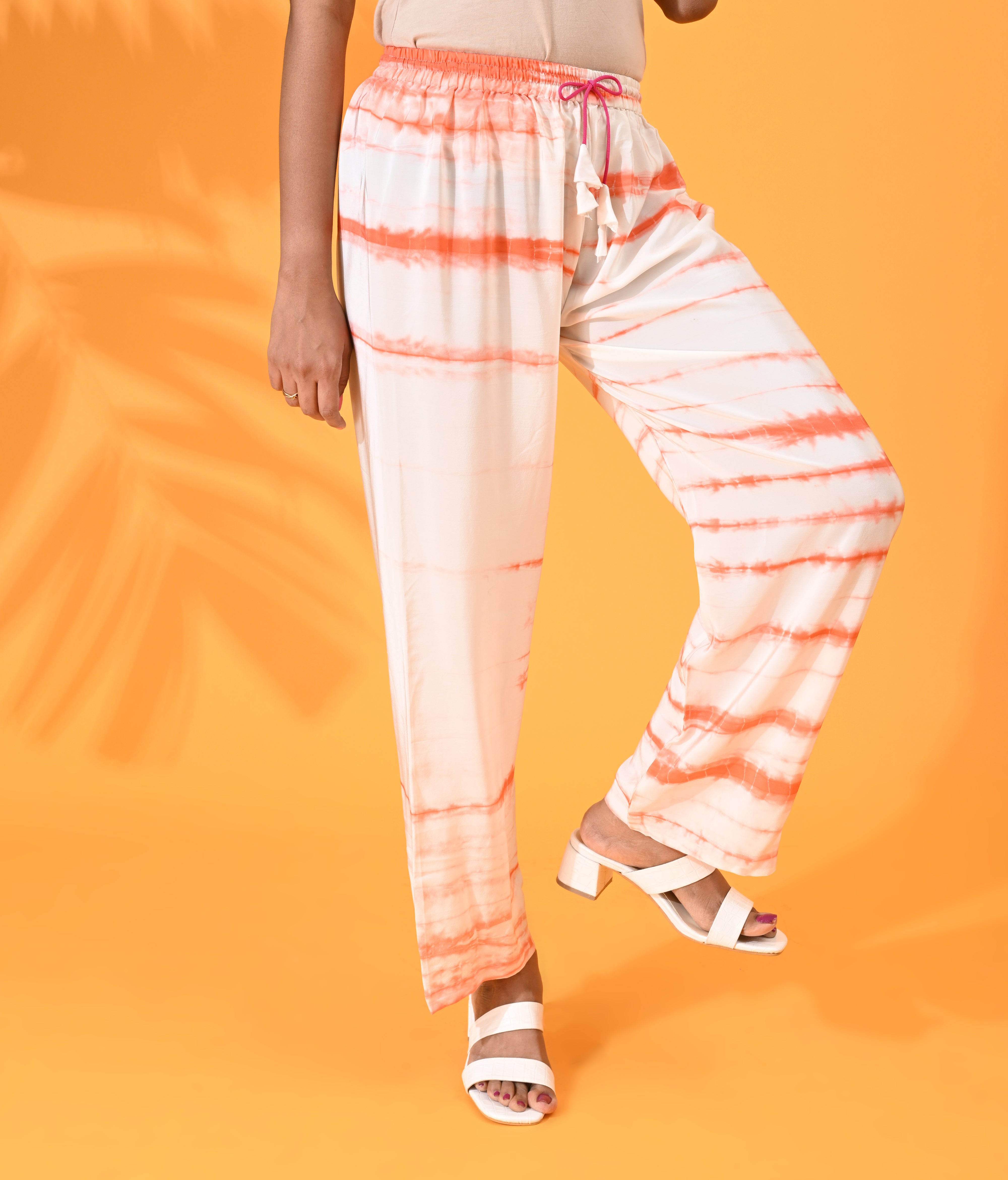 Orange, Orange pant, Orange trouser, Orange bottom wear, White, White pant, White trouser, White bottom wear Silk, Silk pant, Silk trouser, Silk bottom wear Pant, Trouser, Casual wear, Bottom Wear, Shibori Print. 