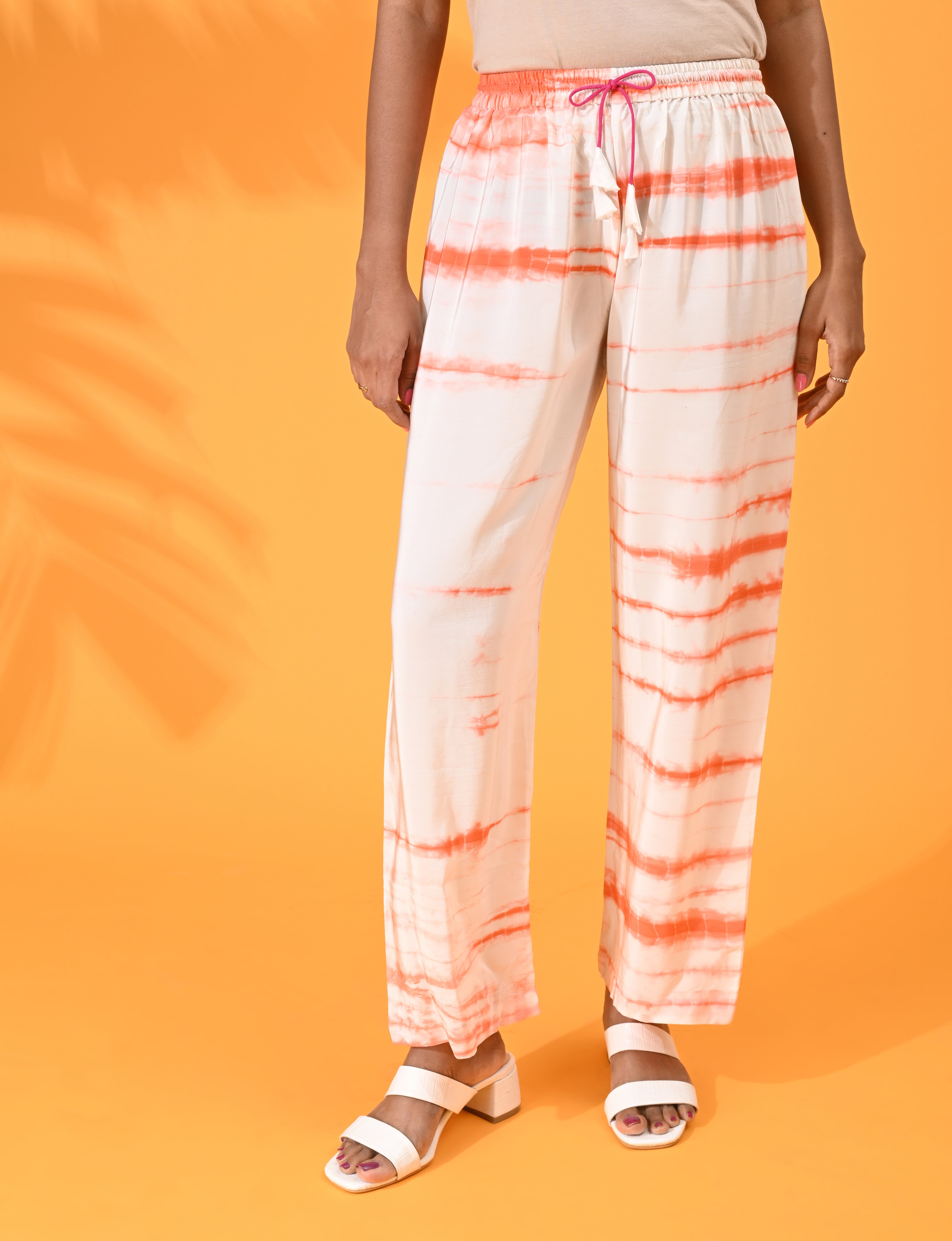 Orange, Orange pant, Orange trouser, Orange bottom wear, White, White pant, White trouser, White bottom wear Silk, Silk pant, Silk trouser, Silk bottom wear Pant, Trouser, Casual wear, Bottom Wear, Shibori Print. 